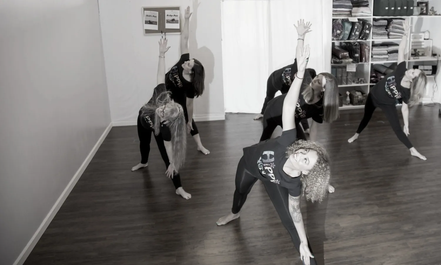 A black-and-white class photograph from Hippie Yoga.